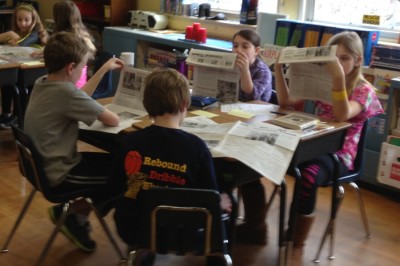 Extra! Extra! Newsies pass out print edition of Colonial Times to students and parents