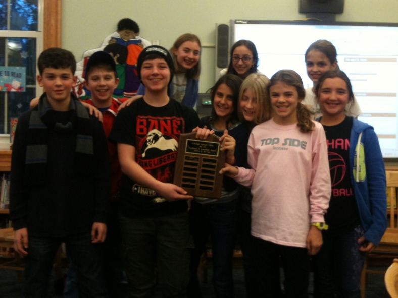 The founding editors of the Colonial Times with the plaque naming them Colonial School’s 2011-2012 Outstanding Journalists.