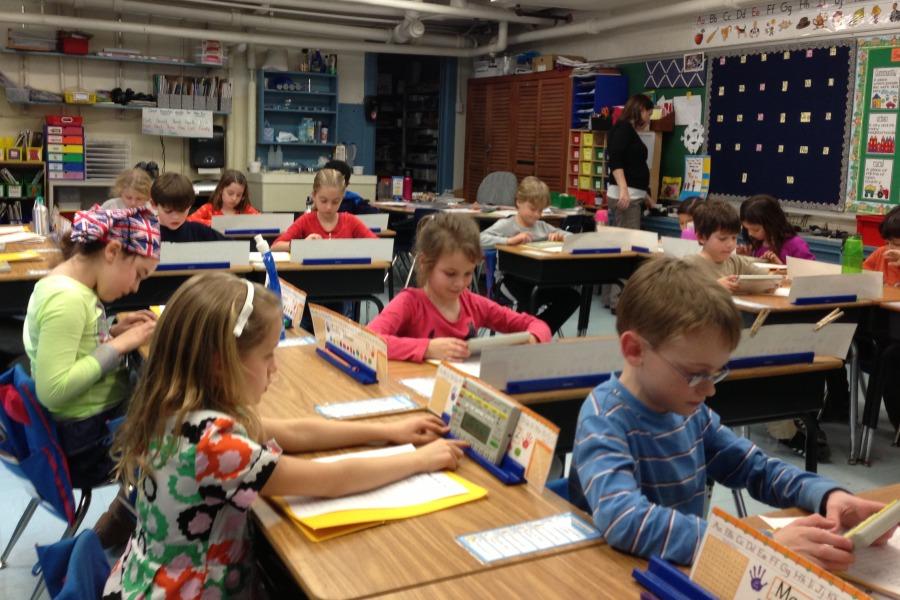 A classroom filled with students and furniture before Covid-19.